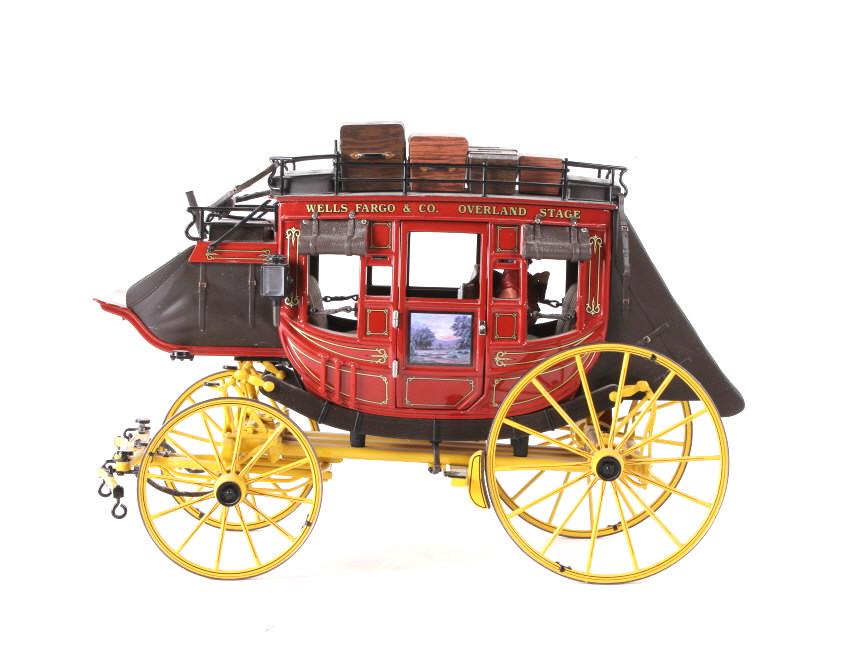 Franklin Mint Wells Fargo & Co. Overland Stage: Offered for your bidding pleasure is this Franklin Mint 1868 Wells Fargo & Co Overland Stage Model Stagecoach. The piece shows a sturdy die cast construction with hand painted accents and added decals
