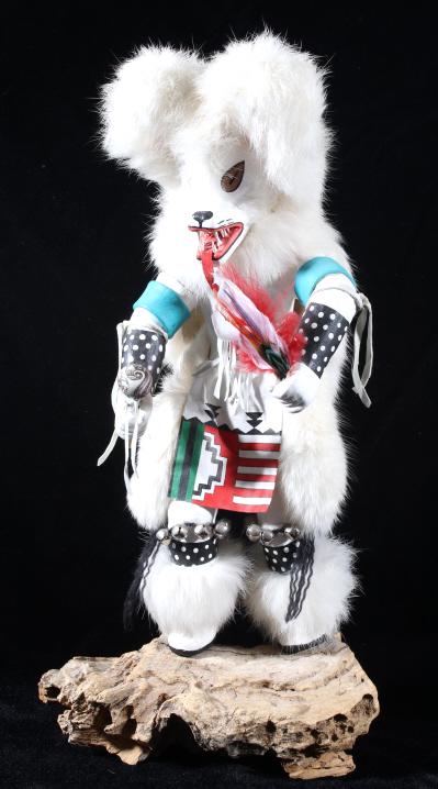 Hopi Wolf Dancer Fetish Kachina Doll: Featured in this lot we have a Hopi Native American wolf dancer Kachina doll originating from the early to mid 20th century. The Kachina shows hand made figure with hand painted designs across the fac