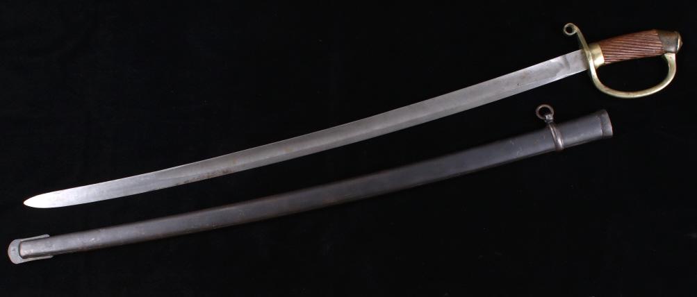 Late 1800's Russian Cavalry Saber & Sheath: Available in this lot we have a Russian Cossack Dragoon saber and sheath originating from the 1880's. The saber shows a single edged cavalry blade with a brass guard and wooden grooved handle. The bla