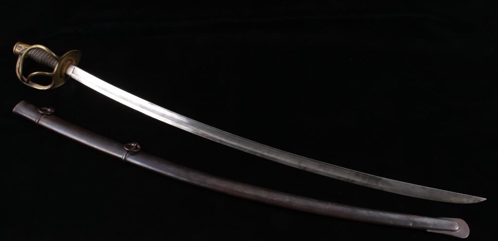 US Civil War Model 1862 Cavalry Saber & Scabbard: Included in this lot we have a Model 1862 US cavalry saber and scabbard originating from the Civil war era. This sword is a model 1862 also known as M1862 and was manufactured by Mansfield & Lamb. The