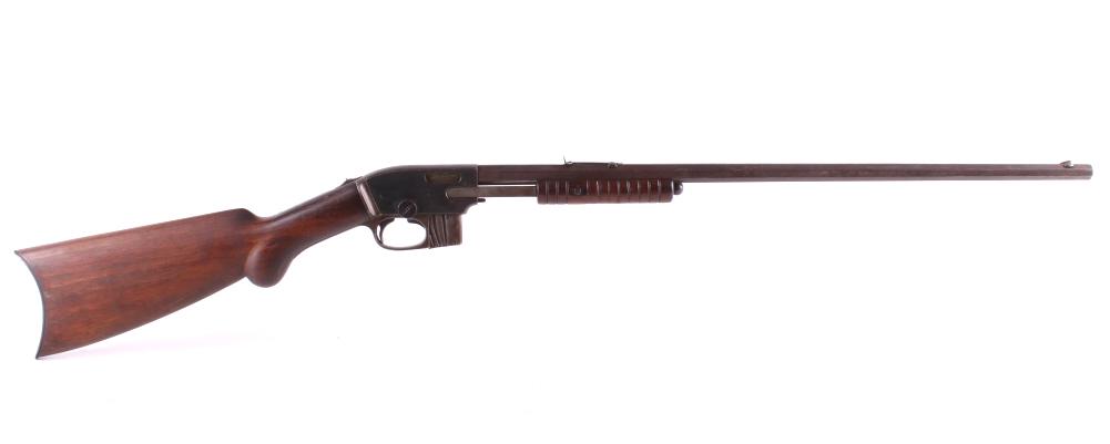 Savage Arms Mo. 1909 .22 Slide Action Rifle c.1906: This is a Savage Arms Company Model 1909 slide-action or pump-action magazine fed rifle chambered in .22 short, long, and long rifle caliber's. The rifle shows a serial number of 64.877, as marked on 