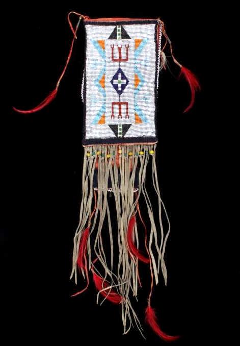 Sioux Loom-Beaded Long Pipe Bag c. 1960-1970's: The piece shows a loom-beaded long pipe bag attributed to the Sioux Native American Indians and the circa 1960’s to 1970’s. The piece shows an Indian tanned hide construction with rectangular sect