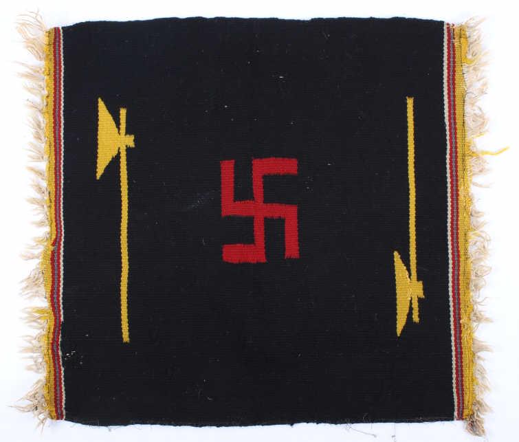 Navajo Whirling Logs Germantown Sampler: The lot features a Navajo Native American Indian Germantown sampler rug showing the iconic whirling logs symbol across the center. This early 1900's rug shows nice natural colors of dark blue, red, ye