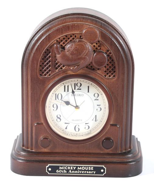 Seiko Quartz Mickey Mouse 60th Anniversary Clock: For your bidding pleasure a Seiko Quartz Mickey Mouse 60th Anniversary mantle clock originating from 1987. This clock shows plastic construction with a wood texture and a embossed decorative piece of