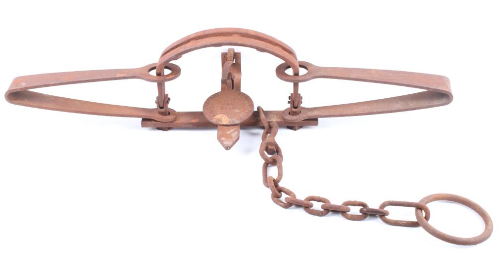 Denali Fur & Trade Co. No. 15 Grizzly Bear Trap: Included in this lot we have a Denali Fur & Trade Company no. 15 grizzly bear trap. This large grizzly bear trap shows thick steel construction with metal teeth along the mouth of the piece. The pan i