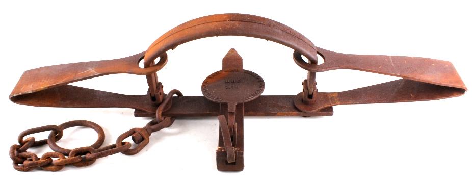 American Fur & Trade HBC No. 6 Grizzly Bear Trap: In this lot we have an American Fur & Trade HBC No. 6 Grizzly Bear Trap. This is a large grizzly bear trap. The pan is marked "American Fur and Trade Company HBC No. 6". The trap features a double spr