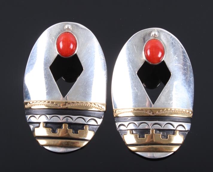 Navajo T. Singer Gold & Sterling Silver Earrings: Featured in this lot we have a pair of Navajo Thomas Singer sterling silver and gold earrings. Tommy Singer was a World Famous Navajo Silversmith and his distinct style of Indian Jewelry is recognized
