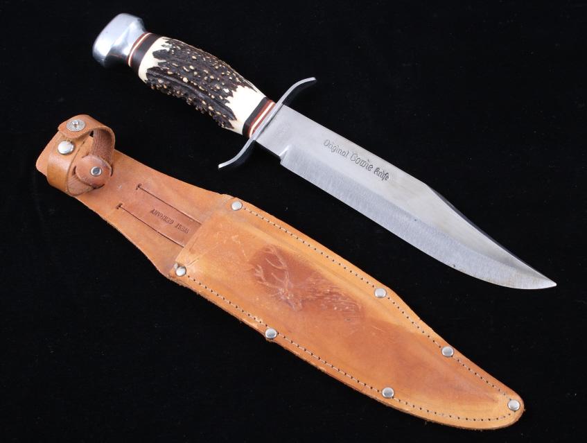 Solingen Deer Antler Handle Bowie Knife w/ Sheath: Offered in this lot we have a German made Solingen bowie knife with deer handle grip and leather sheath. The knife shows a stainless steel blade with a steel guard, wood and antler grip, and stainless