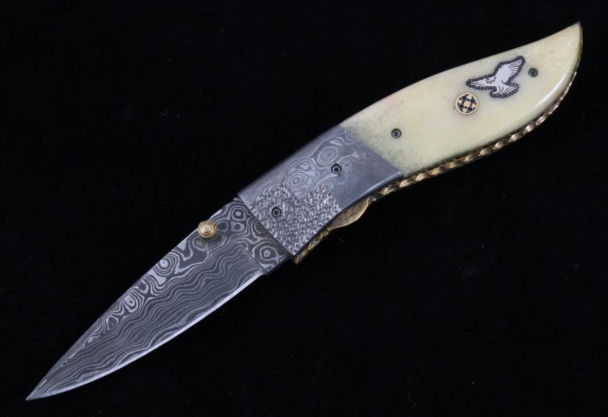 Navajo Yellowhorse Damascus Silver Eagle Knife: We are proud to be one of the exclusive knife makers to offer David Yellowhorse custom Damascus pocketknives. David Yellowhorse has transformed this Damascus knife into visions of his Navajo heritage 