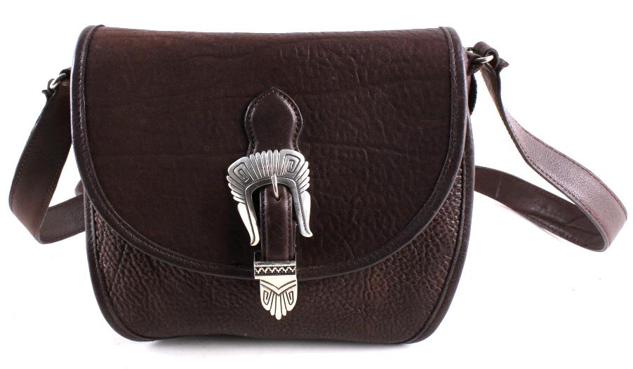 Tommy Singer Signed Sterling Silver Navajo Purse: In this lot we have a signed sterling silver Navajo Native American purse. This Navajo Native American purse is made out of brown leather. At the front of this purse there is a fake buckle that is han