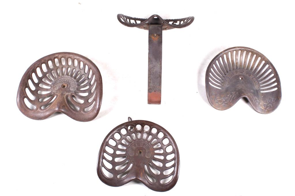Collection of Cast Iron Tractor Seats Late 19th C.: For your consideration is this collection of cast iron tractor and implement seats circa late 19th century. This is a good collection of tractor seats with brand names including Jones-Rake, Champion, 