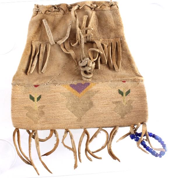 Nez Perce Corn Husk & Hide Flat Bag c. 1890: The lot features a very fine early circa 1890's corn husk and hide flat bag from the Nez Perce Native American Indians. The bag shows a very tightly woven corn husk fiber bag showing mineral pigment d