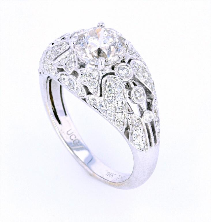 Art Deco 2.12 ct. Diamond 18K Gold Ring: The lot features a fine 2.12 carat Diamond 18K gold ring showing a nice early age. The ring shows a fantastic Art Deco 1920’s style having a gorgeous filigree, engraved and cluster set 18 karat whit