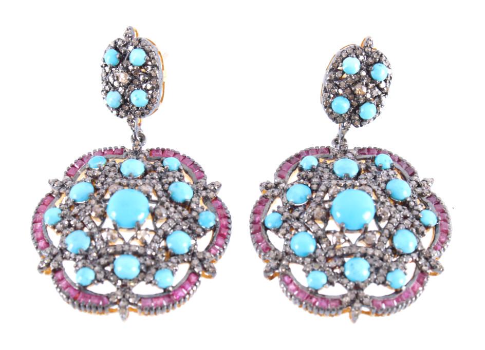 Art Nouveau Turquoise, Ruby & Diamond Earrings: The lot features a wonderful Art Nouveau design dangle earring set with Turquoise, Ruby and Diamonds with a 14K gold and 925 sterling silver construction. The set shows a 14K yellow gold wash with a s