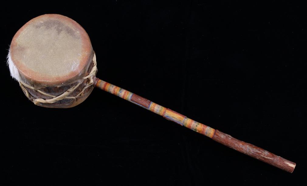 Plains Indian Rawhide Dance Rattle: For your consideration in this lot we have a Plains Indian rawhide dance rattle. This piece displays wooden construction with rawhide stretched across the top. The top of the rattle shows rawhide wrap