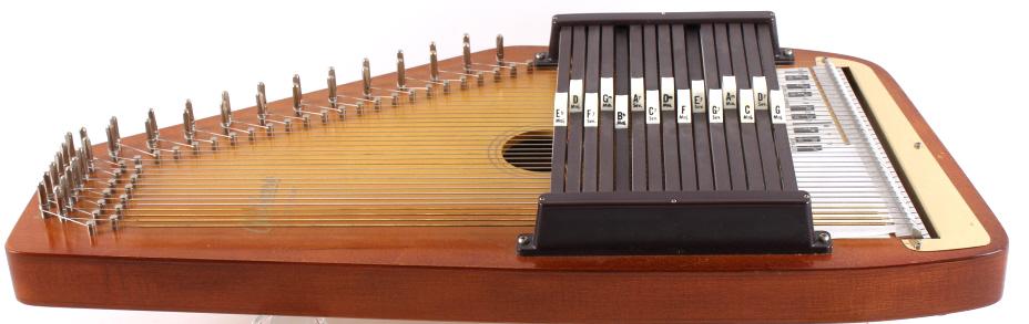 Autoharp OS21C by Oscar Schmidt with Case: In this lot we have an autoharp by Oscar Schmidt. The Oscar Schmidt company was founded in 1871 and incorporated in 1911. The company thrived in the 1920's with them selling their instruments in many 