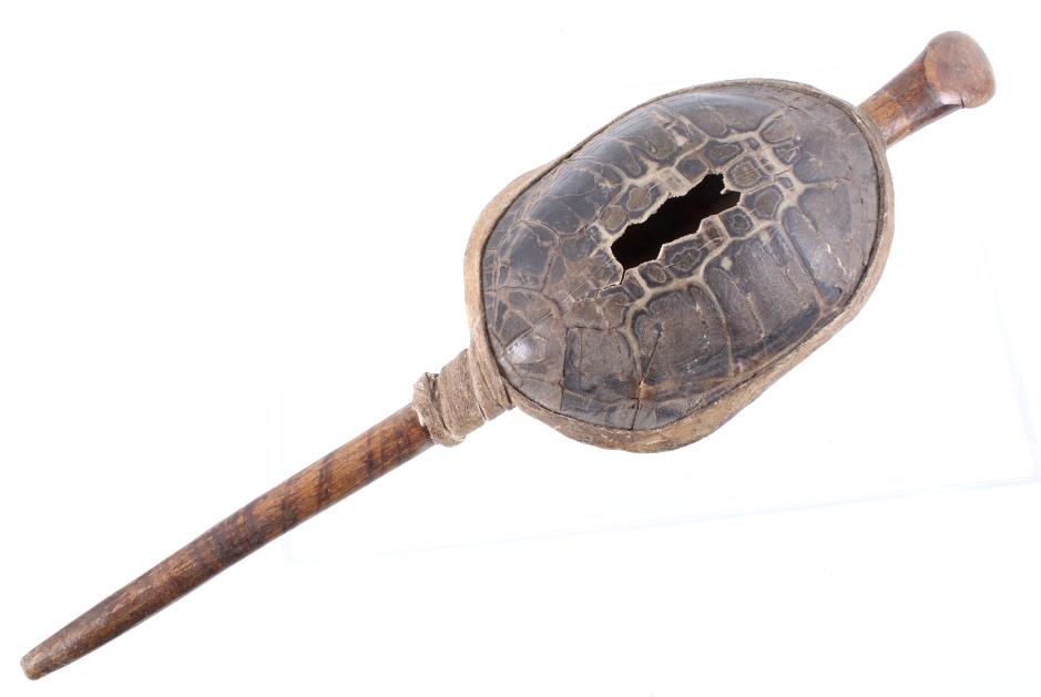 Northern Plains Turtle & Rawhide Rattle c. 1890: The lot features a fantastic turtle rattle with hardwood handle and rawhide wrapping from the Northern Plains Native American Indians of circa 1890. The piece shows a full turtle shell with amazing na