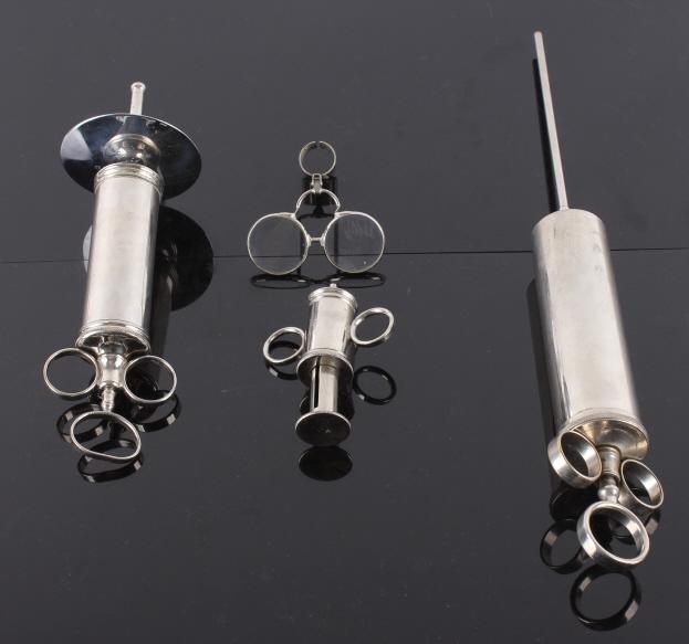 Medical Syringes & Magnifying Glasses Collection: For your consideration is this collection of medical syringes and magnifying glasses shown from the early 1900's. These stainless steel medical syringes show three different sizes and different uses, 
