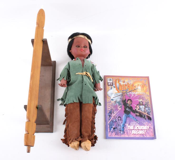 Native American Doll, Pipe Stem & Chickasaw Comic: Included in this lot we have a Native American doll, pipe stem with stand, and first edition of "Chickasaw Adventures" comic book originating from the late 1900's to early 2000's. The doll displays st