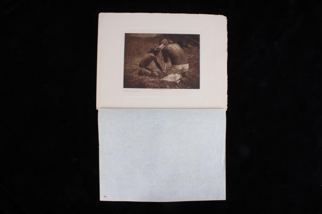 1906 E. Curtis The Fire Drill Apache Photogravure: For your consideration is this photogravure on tissue paper cal;led The Fire Drill - Apache by Edward Curtis from 1906. This photogravure shows two Native American Apache's working the fields during a