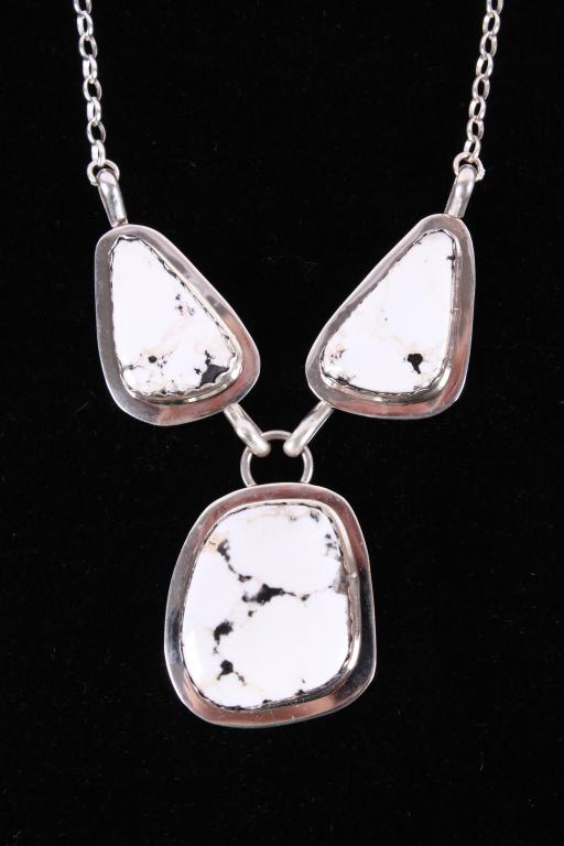 Navajo B. Tsosie White Buffalo Sterling Necklace: Included in this lot is an original Beradine Begay Tsosie Navajo Native American White Buffalo necklace. This necklace features polished White Buffalo gemstones. The stones are set in a shadow box des