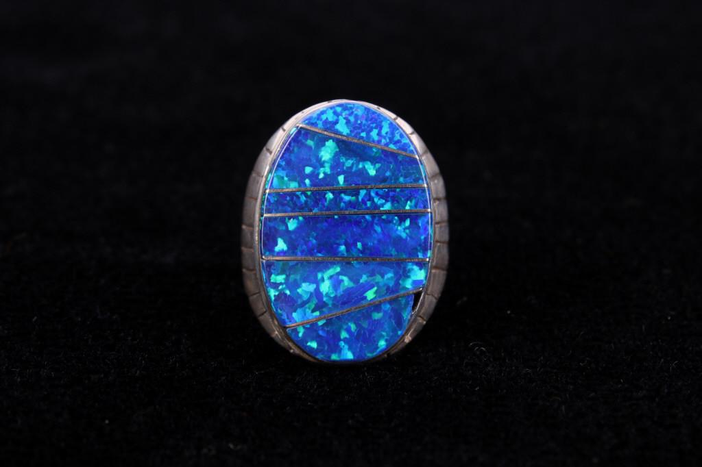 Navajo Wilbert Grey Blue Fire Opal Sterling Ring: Included in this lot is a signed Navajo Native American Wilbert Grey blue fire opal and sterling silver ring. This opal ring features a mosaic inlay of cut blue fire opal divided by a sterling silver 