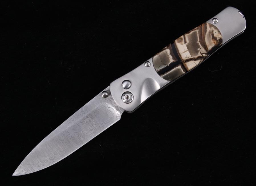 Tesoro Damascus Titanium Mammoth Tusk Knife: This is an excellent custom-made Titanium, Damascus and Woolly Mammoth Tusk pocketknife. The knife features a Titanium body weighing only 2.3 oz. and feature an Odin Heim Damasteel Damascus blade. Thi