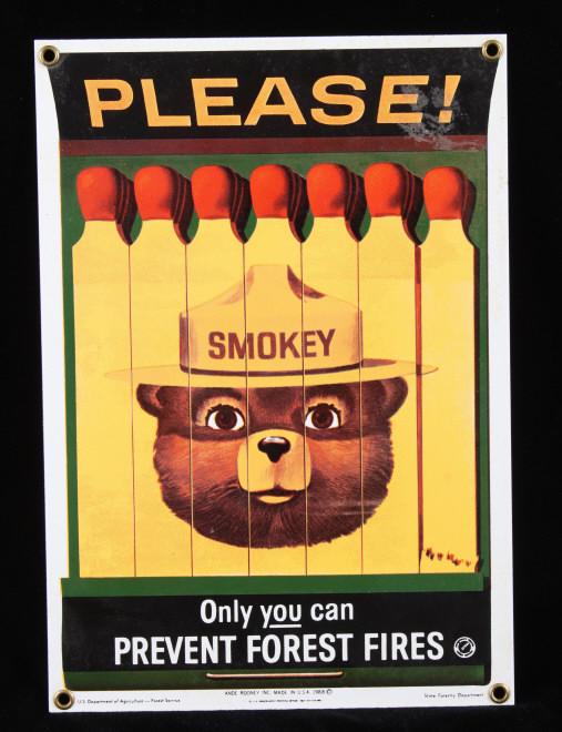 Smokey Bear U.S. Forest Service Porcelain Sign: This is a Smokey Bear porcelain enamel sign. Smokey Bear was adopted by the U.S. Forest Service back in the 1940's as part of their campaign to prevent forest fires. This sign shows a book of matches