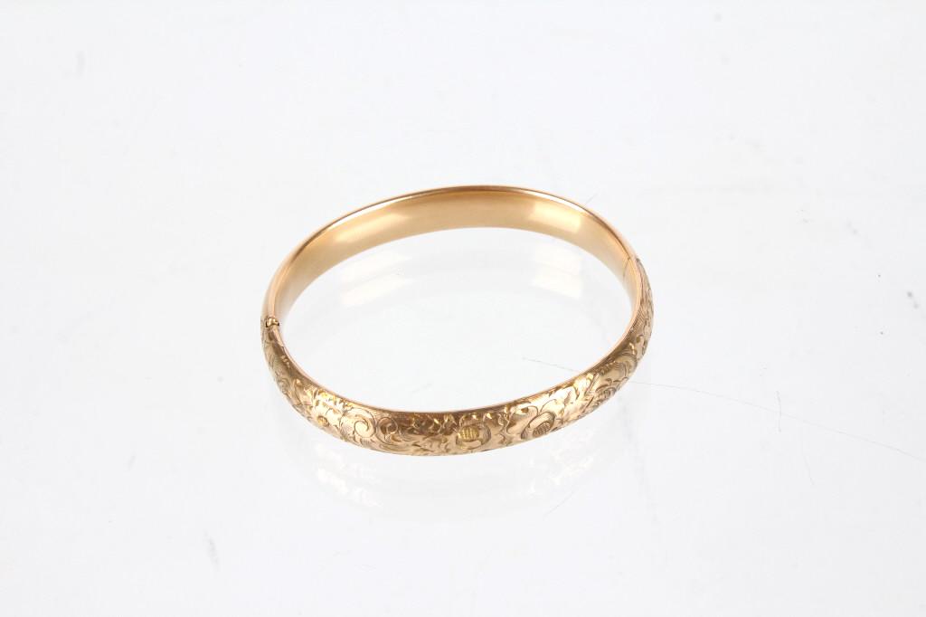 Antique Victorian Gold Floral Engraved Bracelet: Presenting an Antique Victorian 1/10 14K Gold Floral Engraved Lover's Bangle Bracelet. The bracelet features a beautiful romantic floral engraving on the front. This bracelet when given as a gift woul