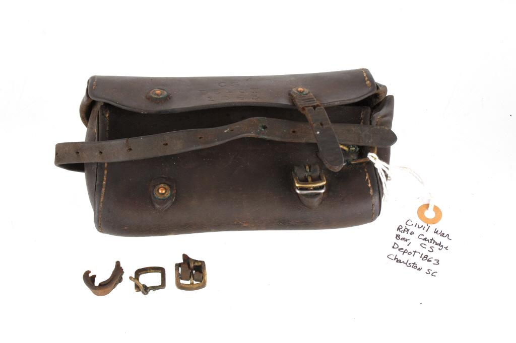 Rare Civil War Leather Rifle Cartridge Pouch 1863: This lot features a rare civil war dark brown leather rifle cartridge box. The pouch features a leather construction, brass hardware, and tooled "CS Depot 1863." The retaining strap and buckle is in g
