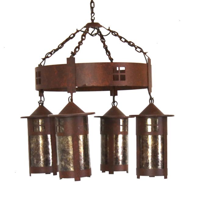 Rustic Four Light Hanging Lantern Chandelier: Featured in this lot we have a rustic metal chandelier with four electric hanging lantern lights originating from the late 1900's. The chandelier displays steel construction with a red/ brown rust sty