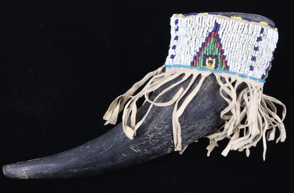 Sioux Beaded Hide Covered Buffalo Horn Cup 19th C.: This is a finely beaded hide covered Buffalo horn ceremonial cup from the 19th Century Sioux Native American Indians. The piece, likely from the Teton Lakota Sioux, shows a Buffalo Bison horn which ha