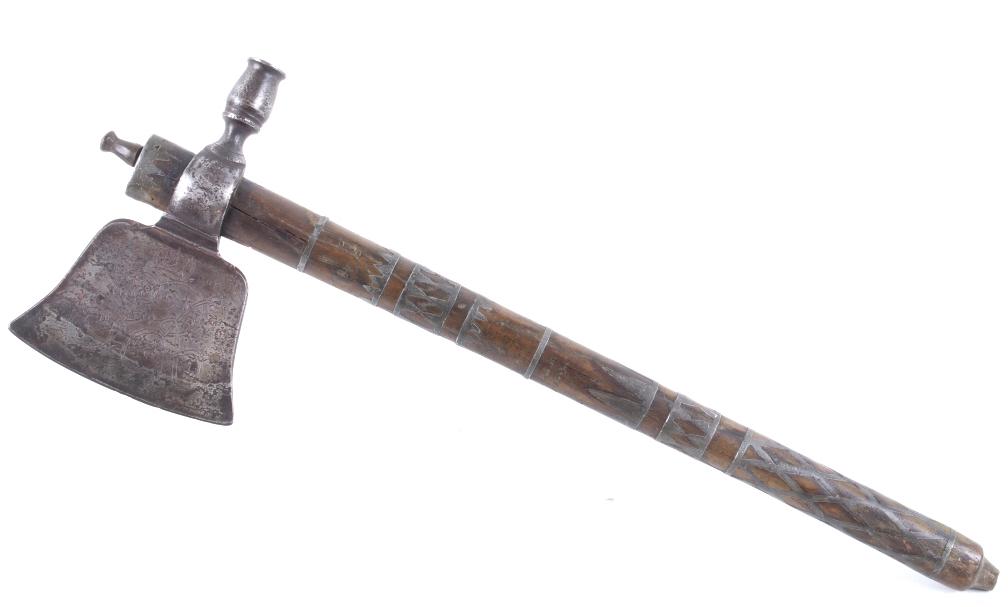 King George III French and Indian Wars Tomahawk: This is possibly one of the finest French and Indian Wars tomahawk to be brought to the public market. This example is highly engraved on the unique bell-shaped crescent curved forged iron blade showi