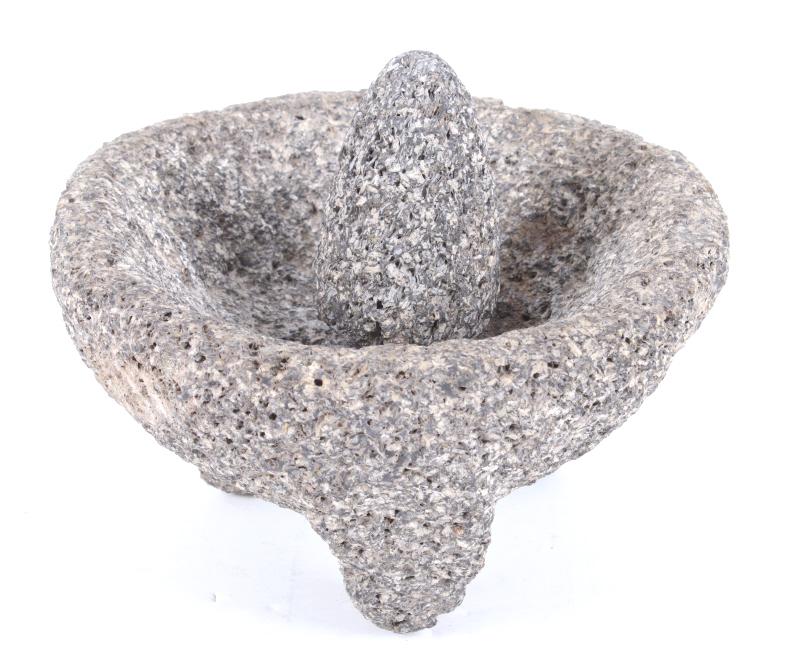 Early 1930's Mexican Spice Grinder Mortar & Pestle: Included in this lot we have a Mexican spice grinder mortar and pestle originating from the early 1930's. The set displays rough stone construction with three thick legs across the bottom of the morta