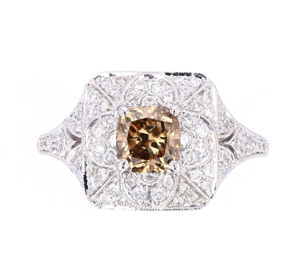 Fancy Brown Diamond Vintage Estate 18K Ring: The lot features an outstanding fancy brown diamond and diamond 18K gold ring with a wonderful vintage estate age. The ring is hallmarked UCG 18K and 750 and shows a wonderful Art Deco Antique design