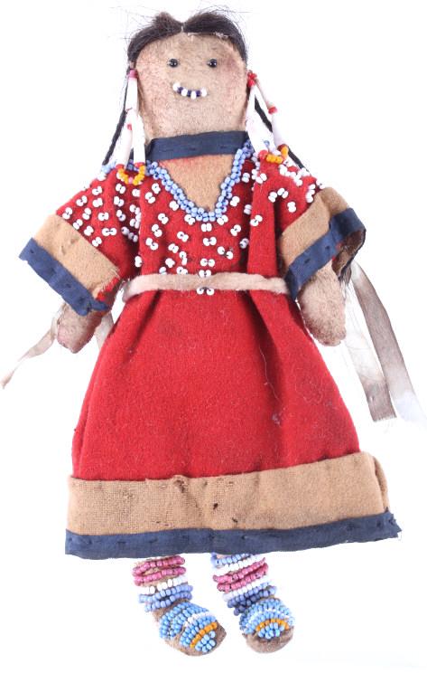 Crow Beaded Hide Doll w/ Dentilium Earrings 19th: The lot features a hide and trade clothe doll with beadwork and a dentalium earrings from the Crow of the 19th Century. This small doll shows a hide construction with sinew and trade thread sewing, tr