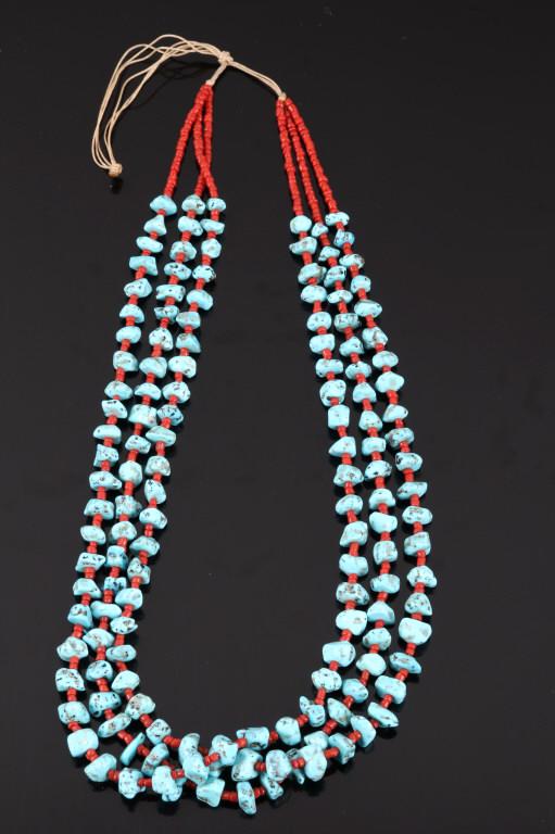 Navajo Sleeping Beauty Turquoise & Coral Necklace: Included in this lot we have a Navajo Native American sleeping beauty turquoise and ox blood coral necklace. The necklace displays three strands of turquoise and coral. The necklace displays 150 nugge