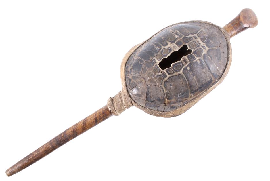 Northern Plains Turtle & Rawhide Rattle c. 1890: The lot features a fantastic turtle rattle with hardwood handle and rawhide wrapping from the Northern Plains Native American Indians of circa 1890. The piece shows a full turtle shell with amazing na