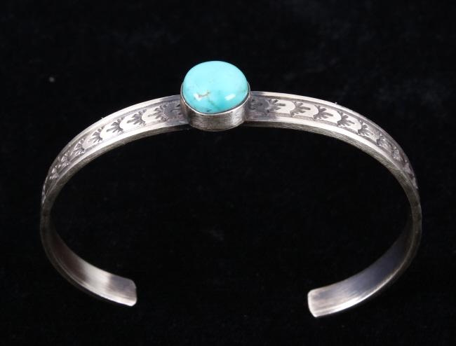 Navajo R. Enriquez Silver & Kingman Turquoise Cuff: For your consideration is a signed Navajo Native American Rick Enriquez sterling silver and Kingman turquoise bracelet. This stunning petite bracelet features a heavily stamped design throughout the c