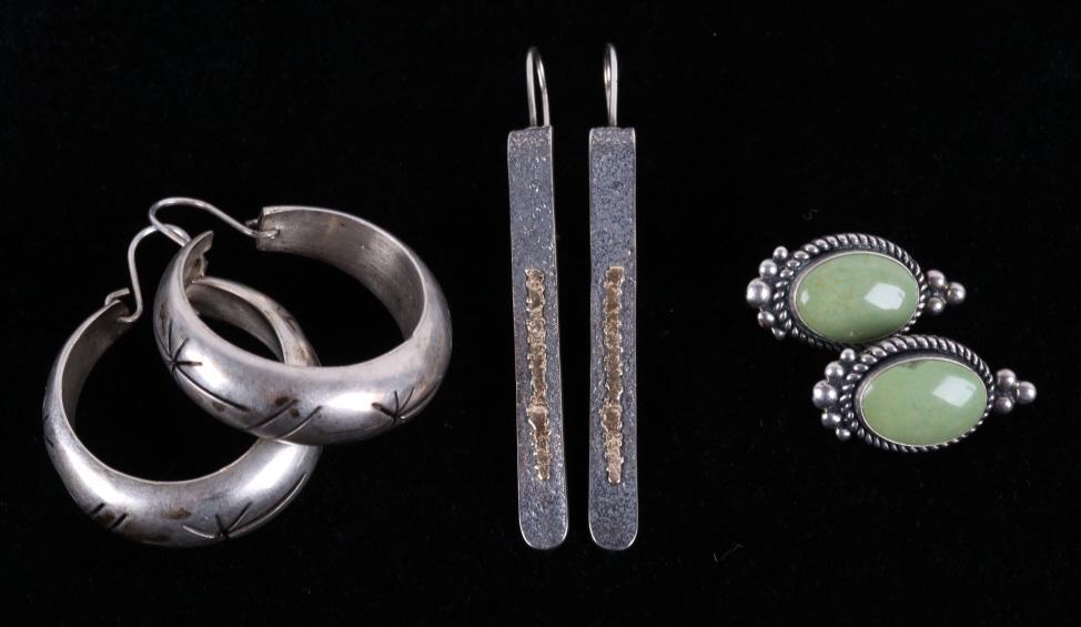 Navajo, Mexican Sterling Silver Earring Collection: Included in this lot is a collection of Navajo Native American & Mexican sterling silver earrings. The larger pair of earrings features a gorgeous hollow form design with hand stamped design around th