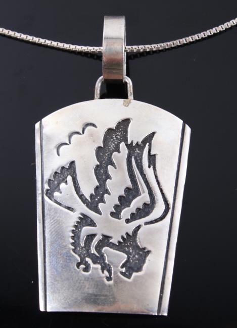 Navajo T. Singer Sterling Eagle Pendant Necklace: Included in this lot we have a Navajo Native American Thomas Singer sterling silver eagle pendant necklace. Tommy Singer was a World Famous Navajo Silversmith and his distinct style of Indian Jewelry 