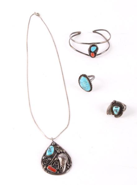 Navajo Silver, & Turquoise Jewelry Collection: Offered in this lot is a collection of Navajo Native American sterling, turquoise, & ox blood coral jewelry. The collection consists of a pendent on a chain, a split band bracelet, and two rings. The 