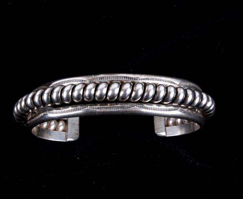 Lee McCray Navajo Sterling Silver Bracelet: For your consideration is this Navajo Lee McCray sterling silver bracelet. This is a gorgeous bracelet showing tooled sterling silver bars flanking a tight coil of sterling silver. The bracelet is mar