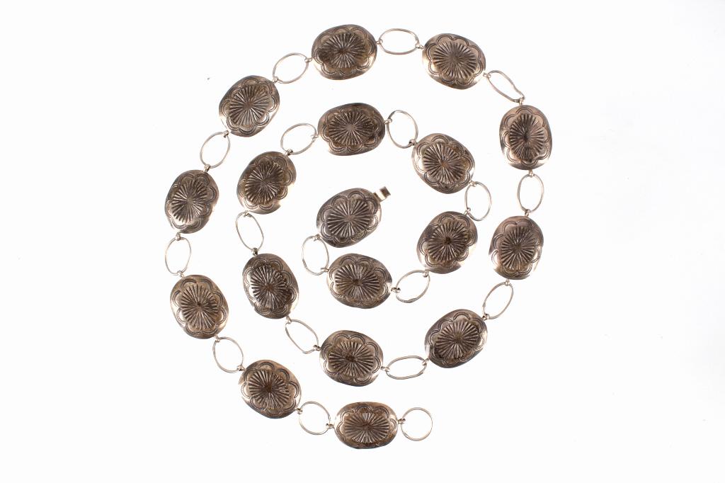 Navajo Sterling Silver Concho Belt c. 1940's: For your consideration is Navajo sterling silver concho belt circa 1940's. This concho belt shows eighteen conchos with traditional Navajo stamped decoration to the face of the conchos and shows a pre