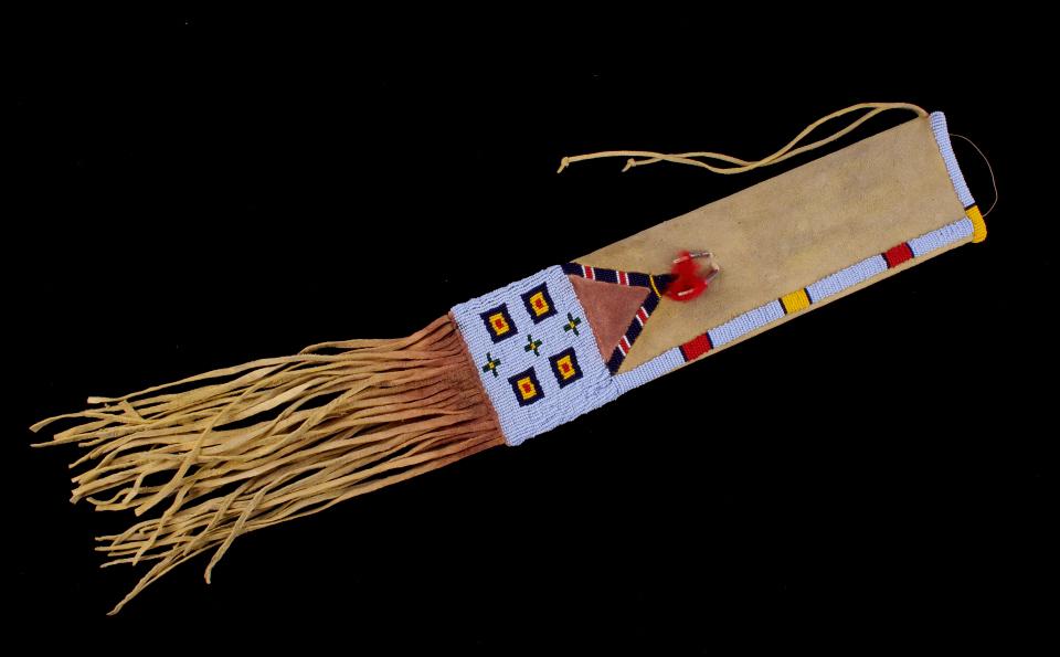 Cheyenne Beaded Tobacco Pipe Bag c. Mid 20th C.: Featured in this lot is this Cheyenne beaded tobacco pipe bag, circa mid-20th century. This is an exceptionally attractive beaded pipe bag with excellent Indian tanned hide construction, glass trade s