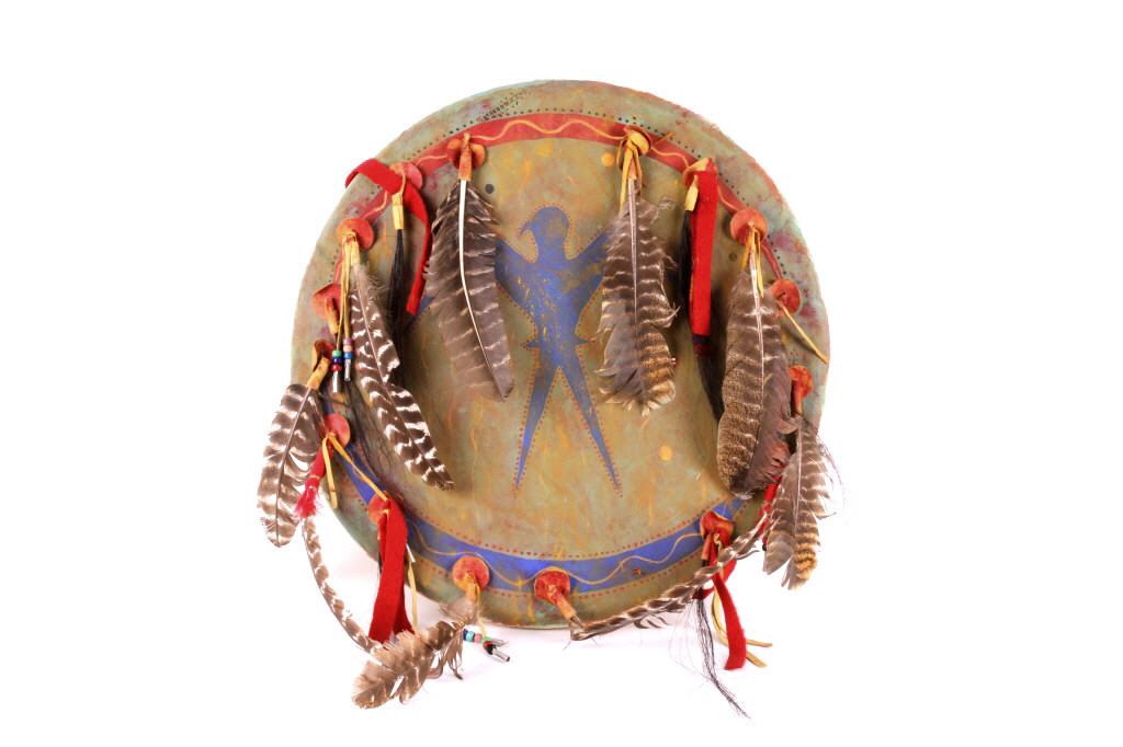 Sioux Polychrome Parfleche Shield Ft. Belknap Tag: The lot features a parfleche rawhide dance shield, which is signed on the rear by Wounded Swallow as being a Sioux Dance Shield. The piece also has an original U.S. Department of the Interior Indian A