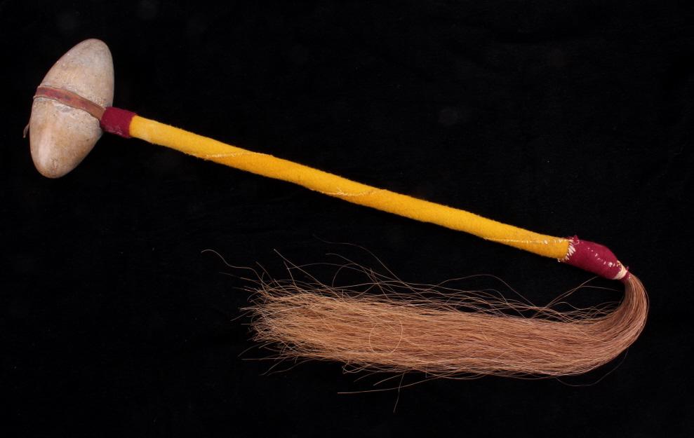 Northern Plains Indians Skullcracker War Club: For your consideration is this Northern Plains Indians skullcracker war club. The war club shows a wide, bi-pointed grey stone head with a high polish, attached to a long wooden haft that is covered i