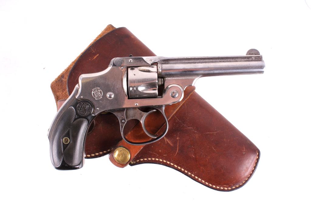 Smith & Wesson Safety Hammerless Revolver: This is a Smith & Wesson 2nd Model Safety Hammerless "Lemon Squeezer" revolver chambered in .32 S&W caliber. The revolver shows a nickel frame, cylinder, and 3 ½” barrel with black hard rubber grip