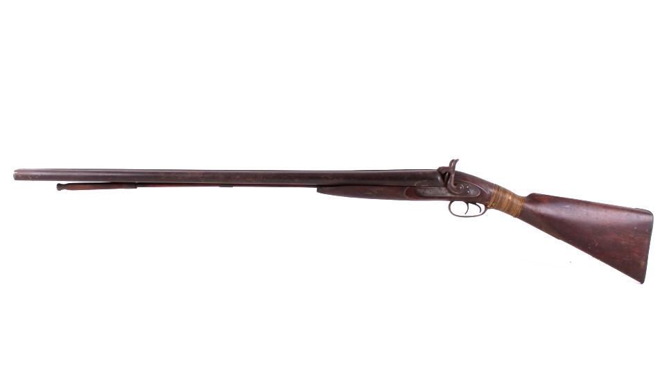 T Walton 12 Ga. Side By Side Percussion Shotgun: For your consideration is a T Walton side by side percussion 12 gauge shotgun. This muzzle loading shotgun utilizes two 34" long blue'd barrels, walnut stock, and external hammers. The walnut stock sh