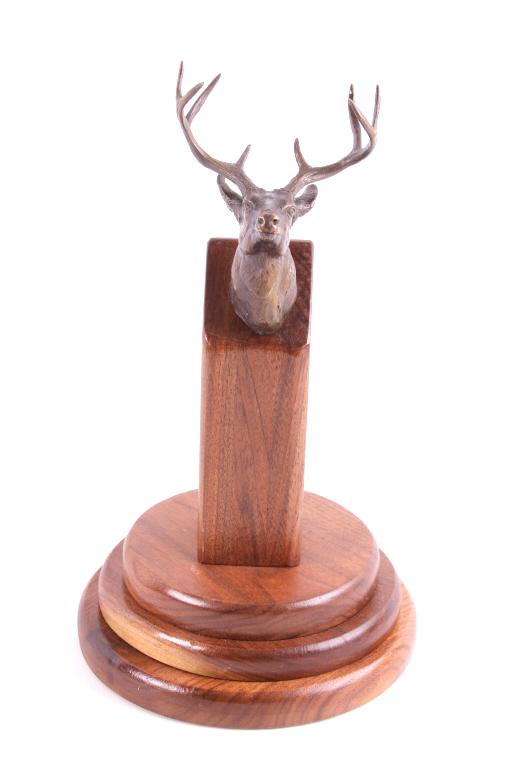 Clark Bronson Bronze White Tail Deer Bust: Offered in this lot is a Clark Bronson bronze, white tail deer bust on a wooden stand. This bronze is signed and dated 1980 on the back of the deer's neck. Bronson was born in Kamas, Utah, in 1939. He